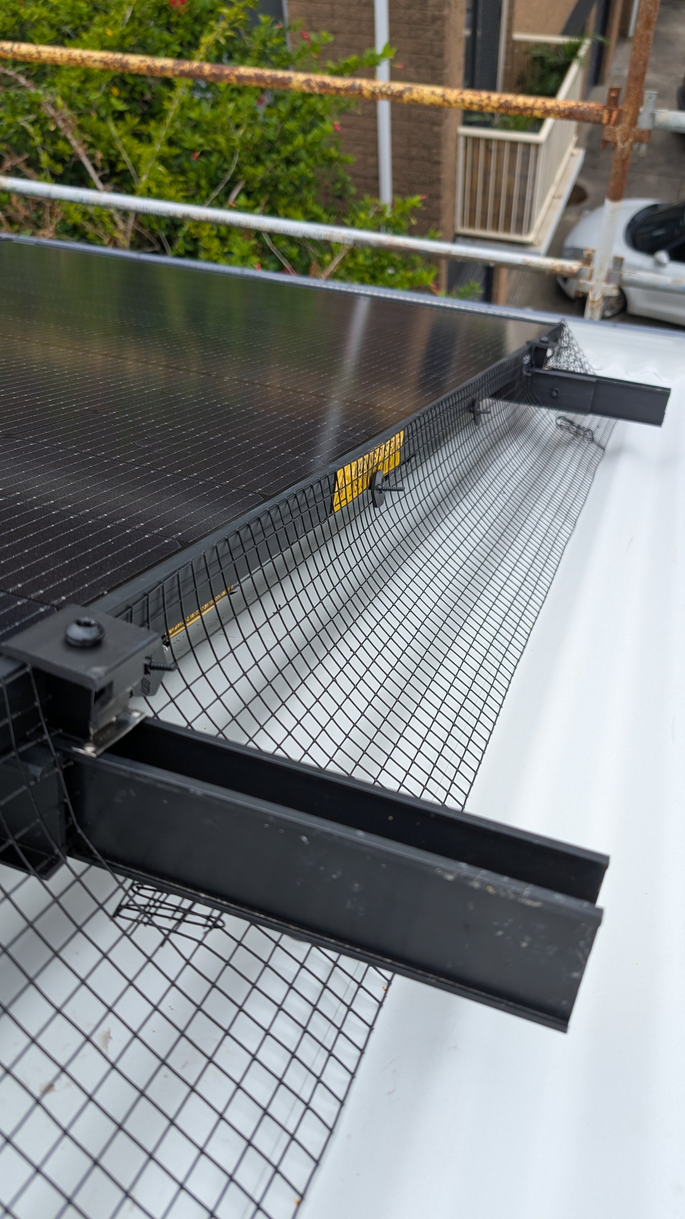 Solar Mesh installed in solar panel on roof, close-up