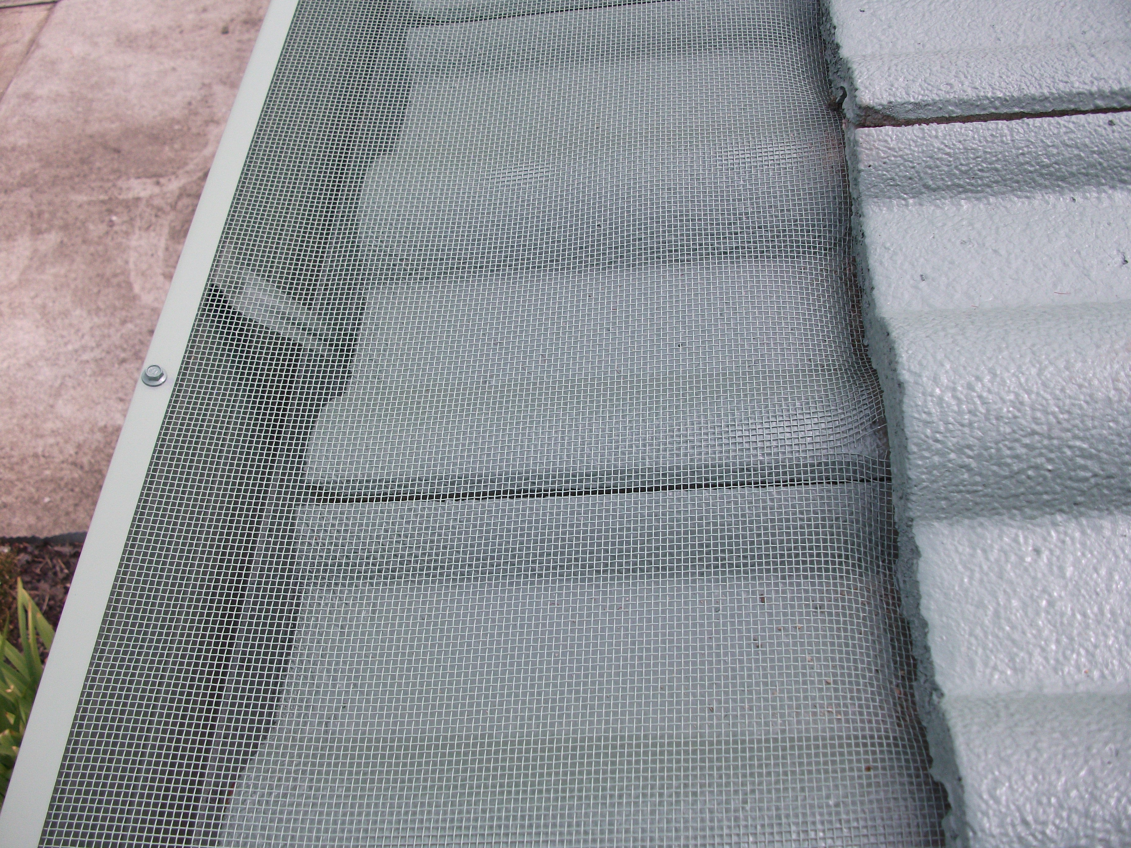 Gutter Guard installed on Tiled Roof - Close-up