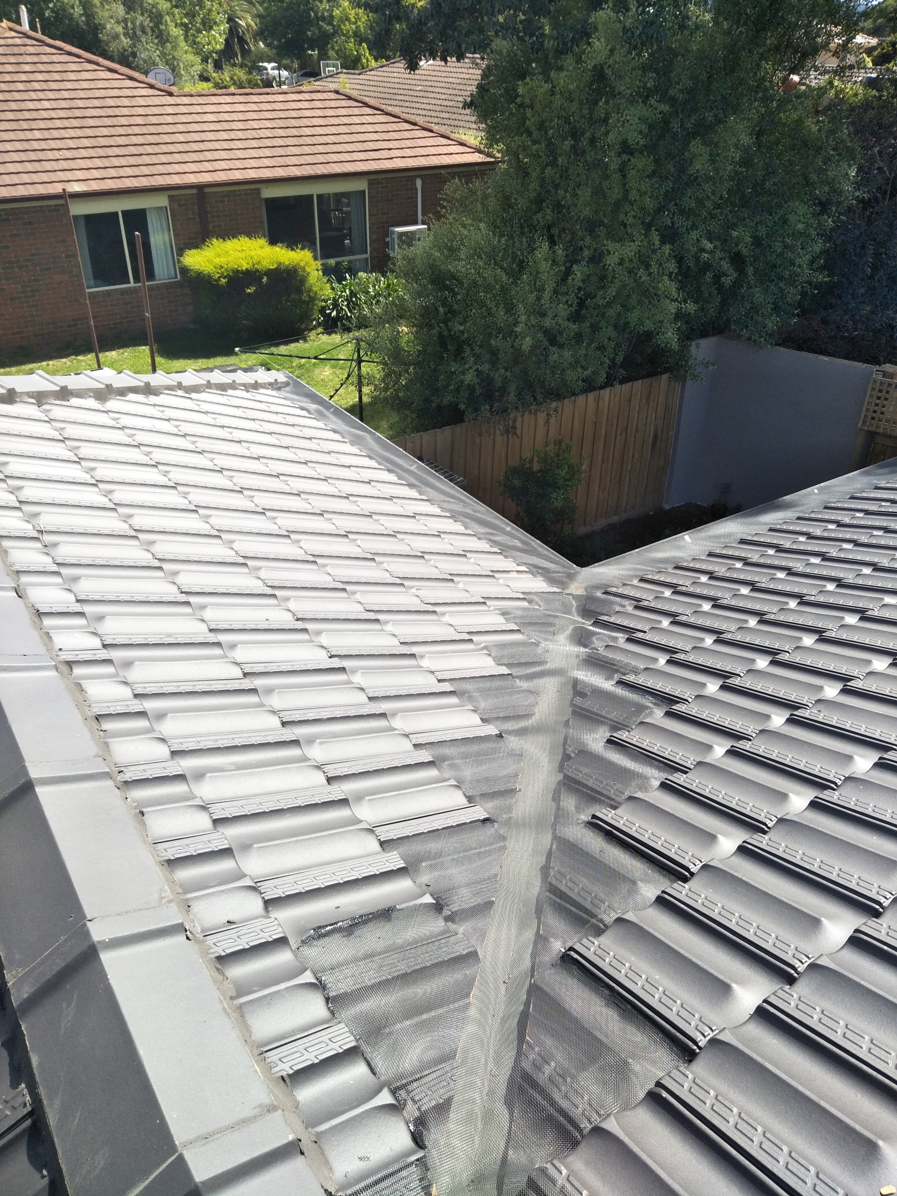 Tiled Valley Roof Ember and Gutter Guard installed