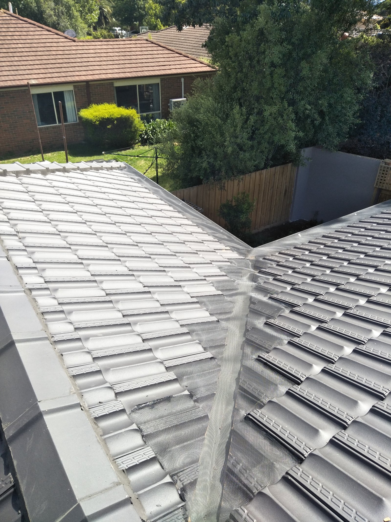 Tiled Valley Roof Ember and Gutter Guard installed
