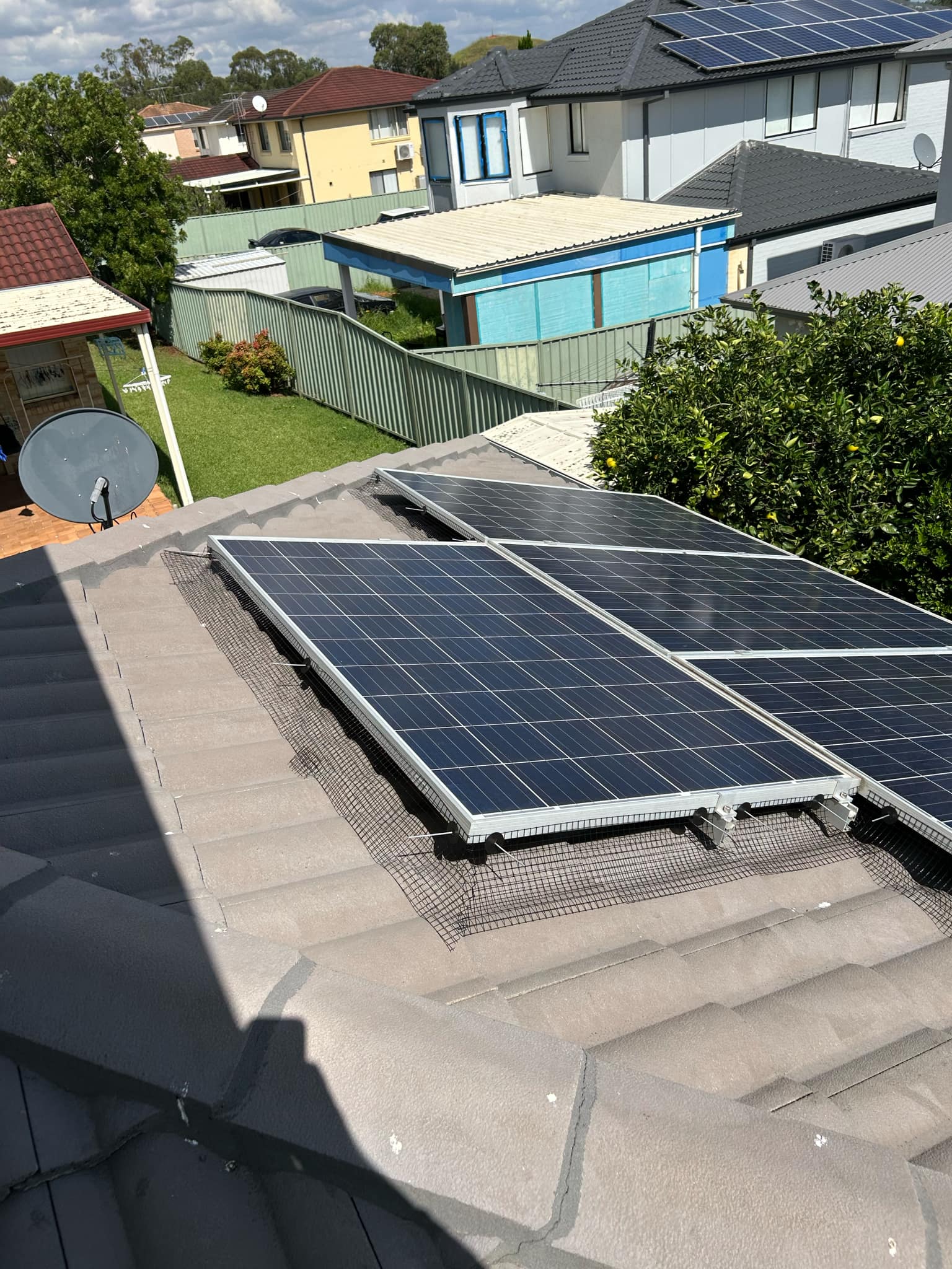 Solar Mesh installed on Solar panels on a residential roof